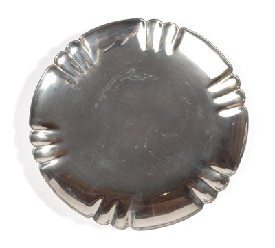 Lot 2315 - An Art Deco Silver Circular Dish, Edward Barnard & Sons, London 1945, the shaped circular dish with