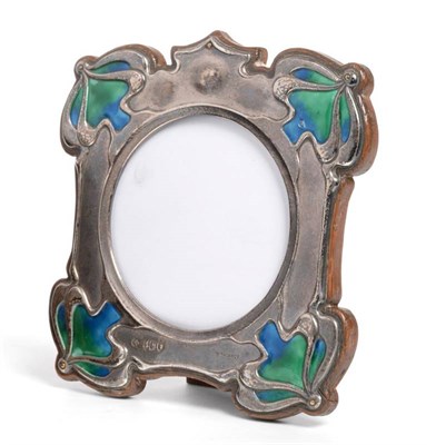 Lot 2329 - An Edwardian Art Nouveau Silver and Enamel Photograph Frame, William Hutton & Son, London 1904,...