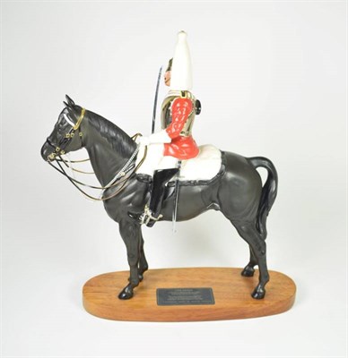 Lot 133 - Beswick Connoisseur Lifeguard, (Style two: with sword), model No. 2562, black matt, on wooden...