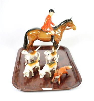 Lot 138 - Beswick Huntsman (Style Two: Standing), model No.1501, brown gloss, with four hounds and a fox...
