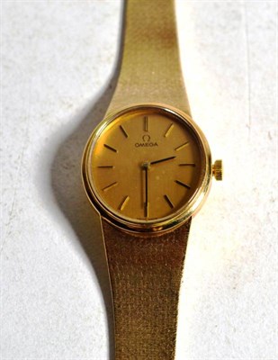 Lot 1 - A 9 carat gold lady's Omega wristwatch, mesh strap, hallmarked, champagne dials