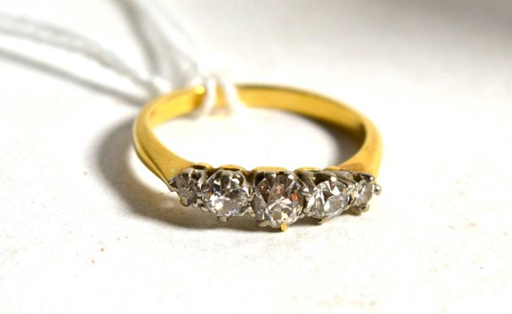 Lot 2 - A five stone diamond ring, the old cut diamonds in white claw settings, to yellow knife edge...
