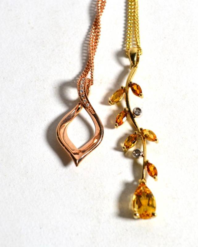 Lot 8 - A 9 carat gold citrine and diamond pendant on chain, the pendant of foliate form comprising of...