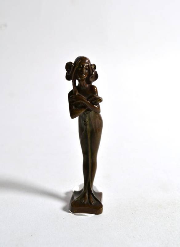 Lot 44 - A small Art Nouveau bronze of a French lady