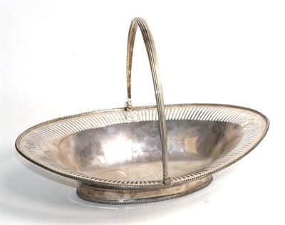 Lot 101 - A George III silver bread basket, maker's mark TC, London 1784, of pale pierced navette form raised