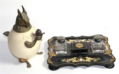 Lot 112 - A Victorian papier mache desk standish; together with an Ostrich egg with gilt metal mounts, in the