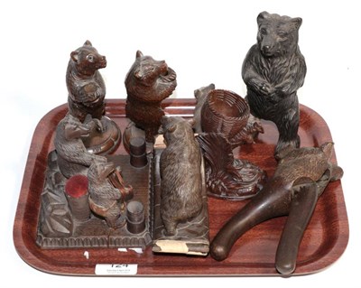 Lot 124 - A group of Black Forest style wooden carvings of bears including two pen holders; an ink...