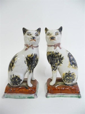 Lot 108 - A Pair of English Pottery Figures of Seated Cats, possibly Sunderland, mid 19th century, with black