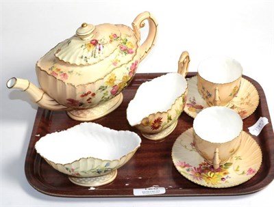 Lot 128 - A group of Royal Worcester blush ground porcelain tea wares comprising teapot, cream, sugar and...