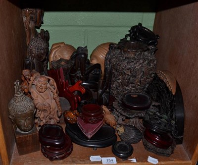 Lot 154 - Two trays of Oriental hardwood carvings, vases and stands, including deities, sages etc