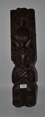 Lot 158 - A carved oak Term figure, 17th century, a fluted vase on his head, his arms crossed over a...