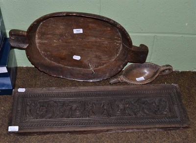 Lot 161 - A dug out bowl, a smaller example, and an ornately carved panel (3)