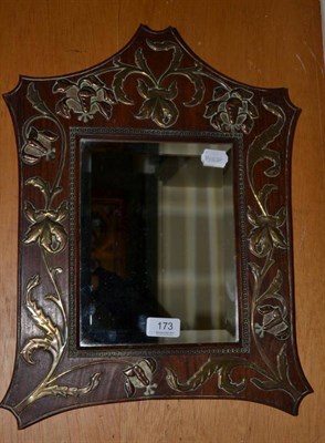Lot 173 - An Art Nouveau mirror decorated with copper, brass and silvered metals