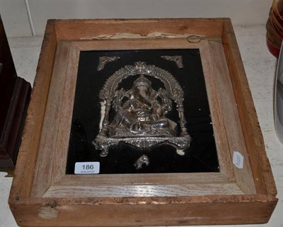 Lot 186 - An early 20th century Indian white metal relief panel on glass of Ganesh