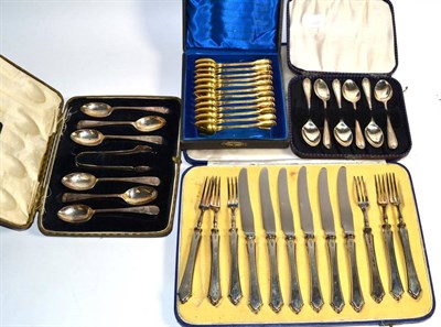 Lot 211 - A George VI six place setting of silver fruit knives and forks, by Mappin and Webb, Sheffield...