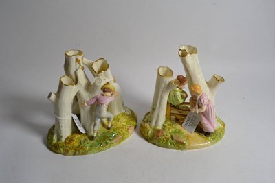 Lot 223 - A pair of Royal Worcester figure groups of children playing amongst trees, each with impressed...