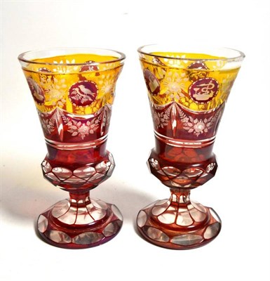 Lot 235 - A pair of 19th century ruby and amber flash glass goblets