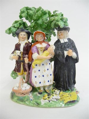 Lot 122 - A Derby Tythe Pig Group, circa 1820, depicting the farmer, wife, baby and parson standing under...