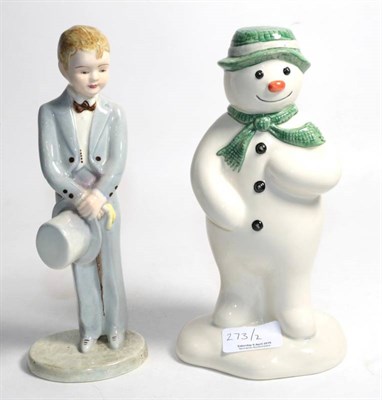 Lot 273 - A Goldscheider/Myott figure of a boy, and a Doulton Snowman Collection money box