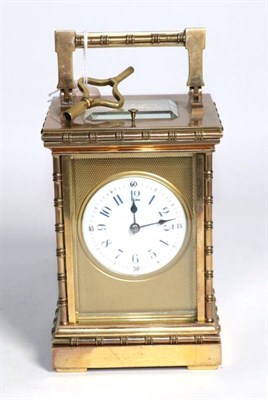 Lot 280 - An early 20th century French brass repeater carriage clock, 8 day striking movement, circular white