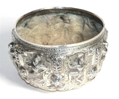 Lot 294 - A large South East Asian white metal bowl, probably Thai, decorated in relief with dancing figures