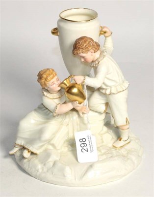 Lot 298 - A Royal Worcester porcelain figure group of a boy and girl at a fountain by James Hadley,...