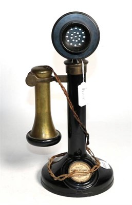 Lot 312 - A vintage brass and bakelite stick telephone