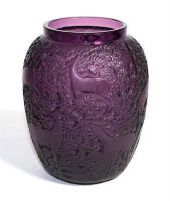 Lot 316 - A relief decorated Baines amethyst glass vase, depicting deer in a landscape, signed Lalique...