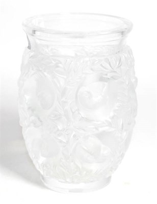 Lot 319 - A frosted glass vase, stamped Lalique France, decorated with circular panels of birds amongst...