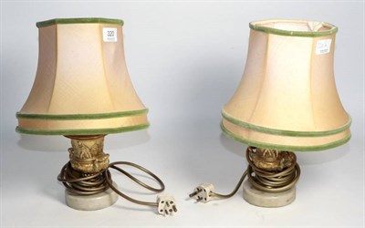 Lot 320 - A pair of gilt metal twin-handled urn lamps