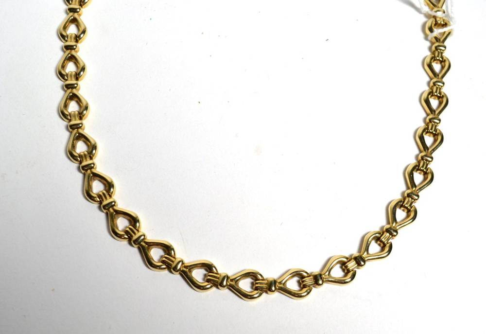 Lot 346 - A fancy link necklace, stamped '9KT', length 44cm