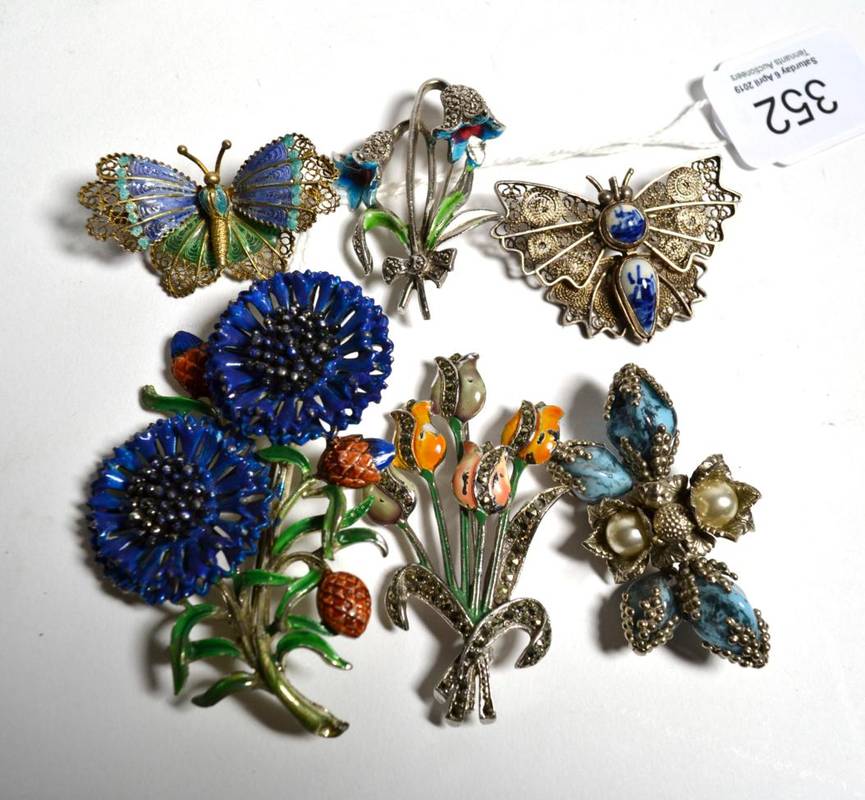 Lot 352 - A group of six marcasite filigree and enamelled brooches in the form of butterflies and flowers