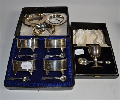 Lot 361 - A cased set of four silver salts, with later silver spoons (one blue glass liner missing); a...