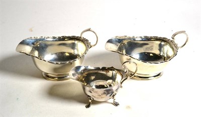 Lot 363 - A pair of silver sauce boats and a small silver cream jug