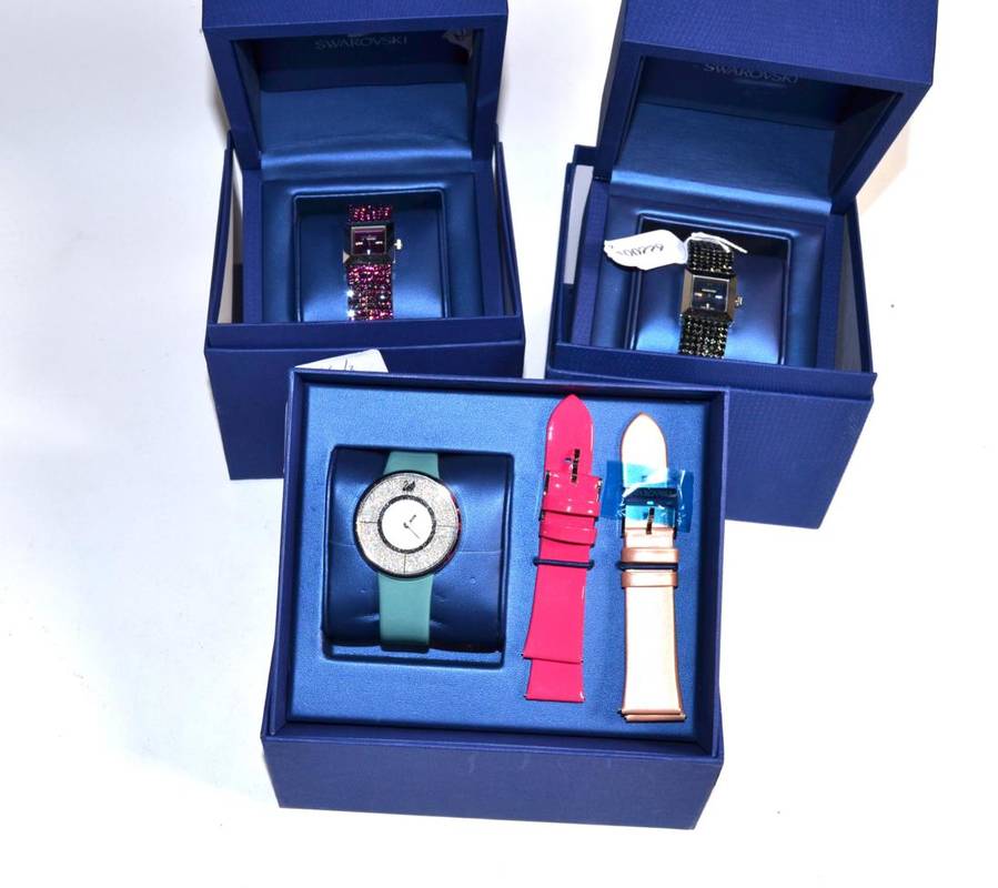 Lot 366 - Three Swarovski watches, with original boxes