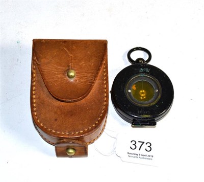 Lot 373 - A hunters compass in a leather case