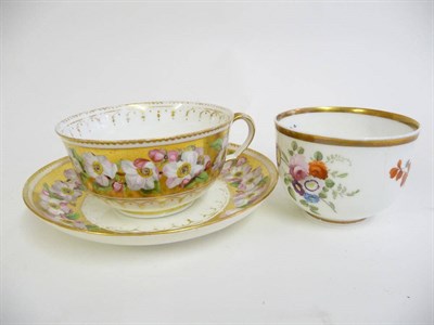 Lot 134 - A Swansea Porcelain Teacup and Saucer, circa 1820, painted with a spray of pink roses within a gilt