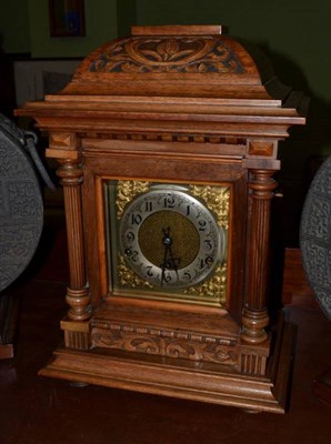 Lot 393 - A walnut quarter striking table clock