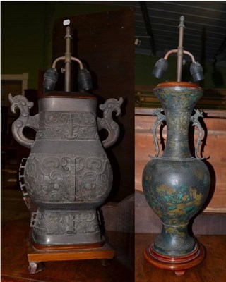 Lot 397 - Two reproduction Chinese patinated metal table lamps