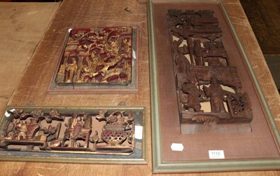 Lot 1110 - Three 20th Century Chinese carved wooden panels, each decorated in high relief with figures and...