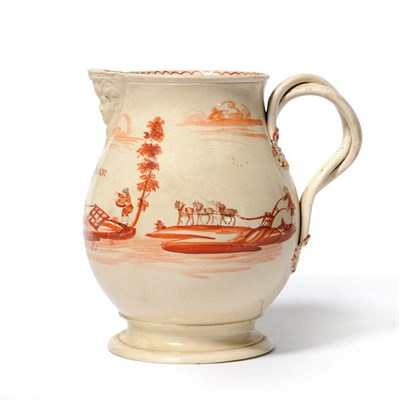 Lot 148 - A Creamware Mask Jug, dated 1775, of baluster form with entwined strap handles and leaf...
