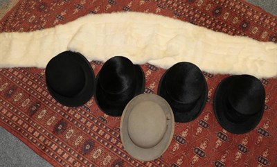 Lot 1122 - C A Dunn & Co black silk hat, two others, two bowler hats and a white rabbit stole (6)