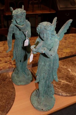 Lot 1145 - A pair of 20th century cast metal garden ornaments in the form of woodland nymphs, with later...