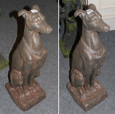 Lot 1182 - Pair of resin models of seated greyhounds, 79cm high