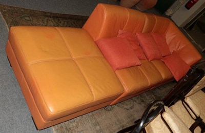 Lot 1188 - An orange leather corner sofa
