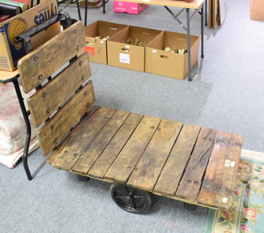Lot 1192 - H C Slingsby, King of tracks; and an early 20th century metal and wooden trolley
