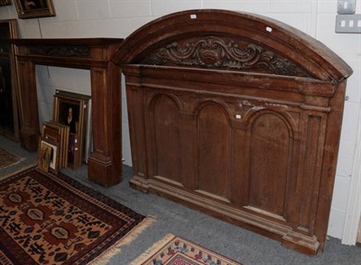 Lot 1198 - An oak fire surround with triple arch panelled superstructure