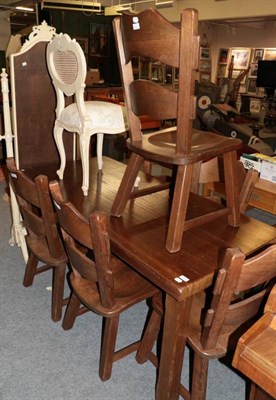 Lot 1222 - A rustic dining table and six chairs