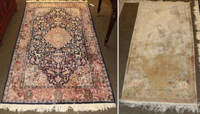 Lot 1240 - A Kashmir silk rug, central dark blue field with animals and foliage; and a smaller Chinese...