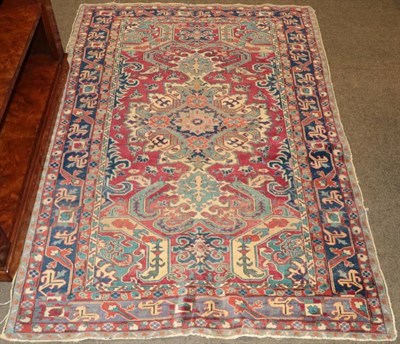 Lot 1241 - Derbend rug, East Caucasus, the blood red field with a central medallion framed by indigo...